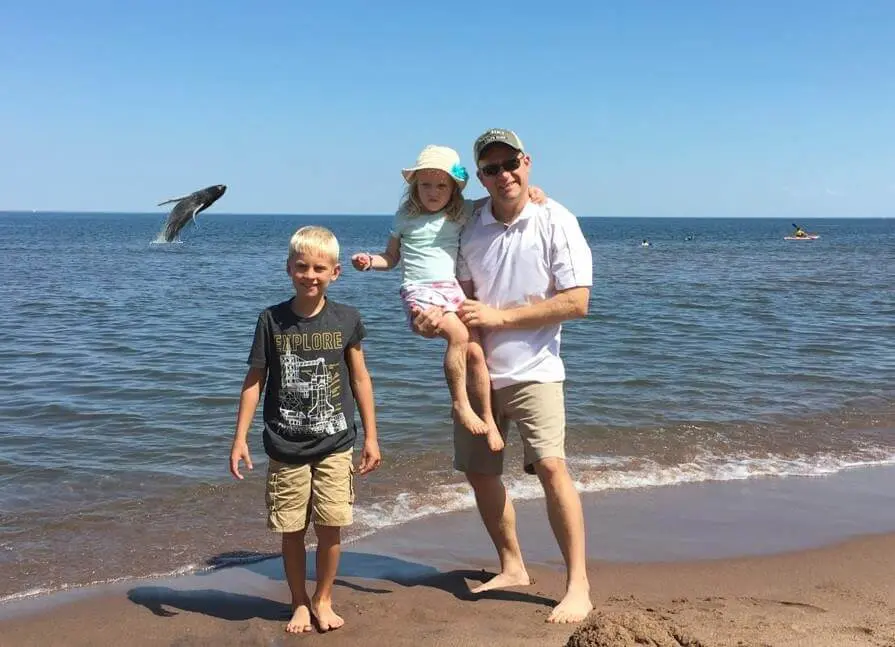 whale jumping behind family at park point in duluth mn